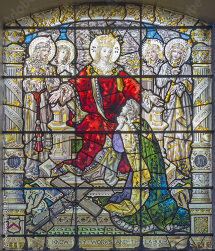 LONDON, GREAT BRITAIN - SEPTEMBER 15, 2017: The resurrected Jesus the King and among the angels on the satined glass of St James's Church, Clerkenwell by T. F. Ward and Hughes manufacturers (1898). photo