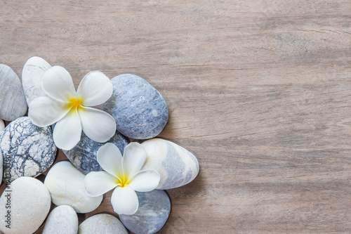 Photography frangipani flower and stone zen spa on wood