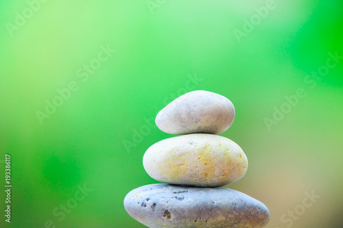 zen stone on green