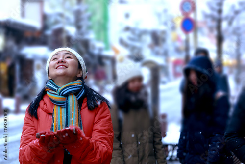 woman enjoy and play on the snow 