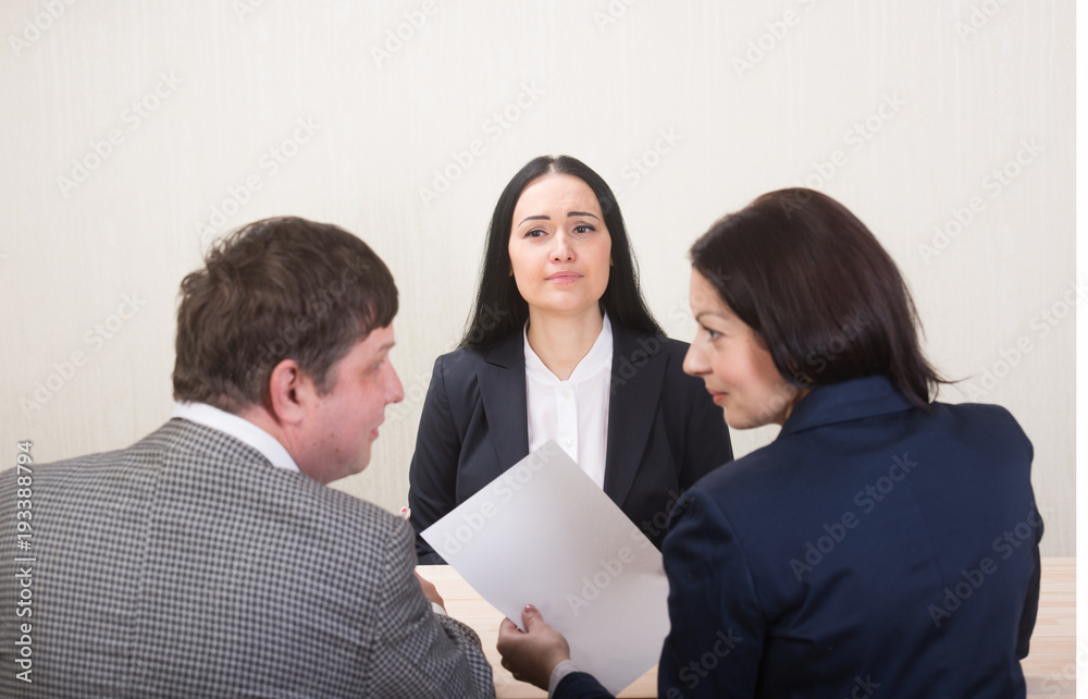 Young woman during job interview and members of managemen. Afraid concept.