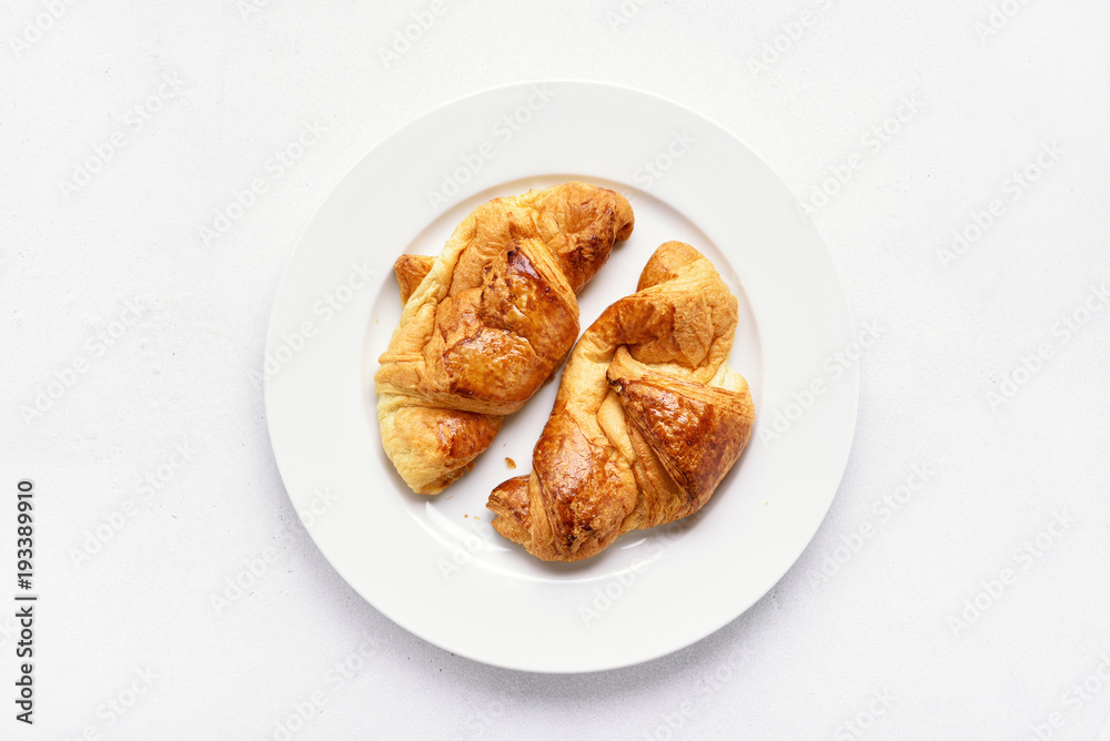 Croissants on plate, top view