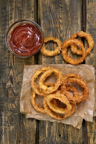 Onion rings with tomato sauce, top view