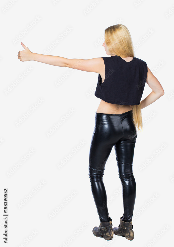 Back view of woman thumbs up. Rear people collection. backside person. Back view of woman thumbs up. Rear people collection. backside person.