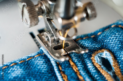 sewing process denim material photo