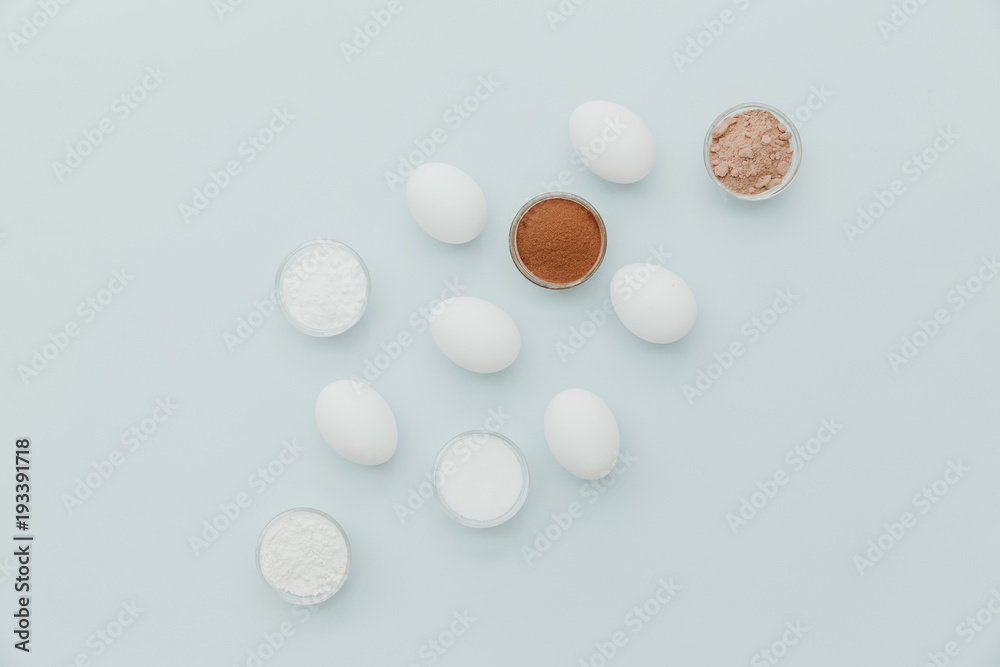 Minimal flat lay baking background. Ingredients for baking cupcakes or muffins Minimal flat lay baking background. Ingredients for baking cupcakes or muffins