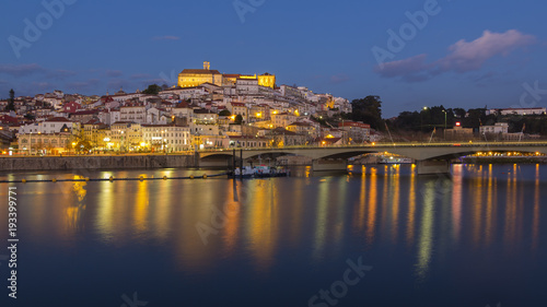 Coimbra city and Mondego river at nightfall photo