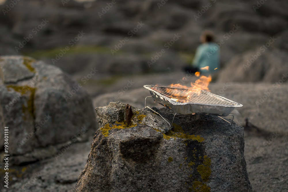 Close up of the orange fire burning in the small grill isolated, soft focus. Norway. Close up of the orange fire burning in the small grill isolated, soft focus. Norway.