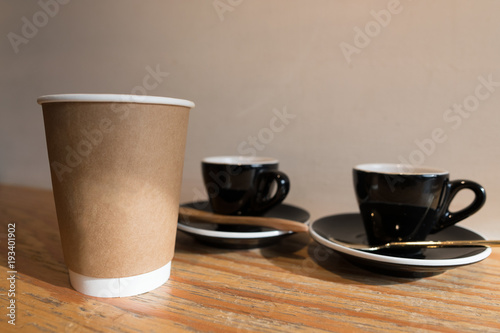 coffee paper cup and espresso in ceramic cup background