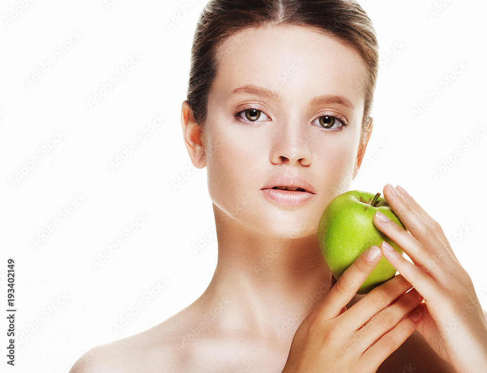 Young woman with green apple, isolated on white background Young woman with green apple, isolated on white background