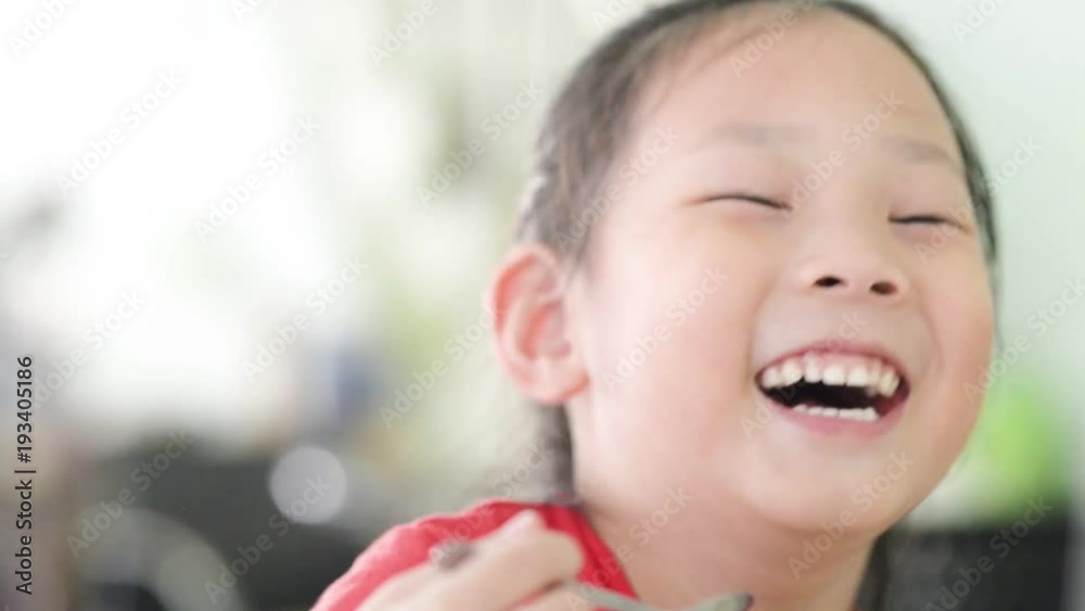 Happy Girl eating ice cream and laughing, lifestyle concept Happy Girl eating ice cream and laughing, lifestyle concept