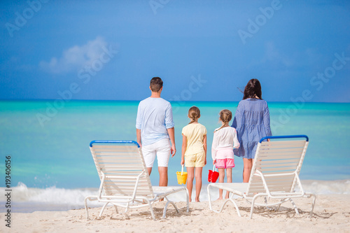 Family of four on beach vacation © travnikovstudio