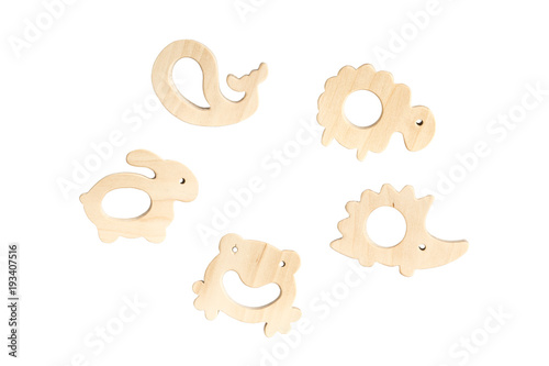 Organic baby teethers isolated on white background with copy space. Wooden animal toys set for babies.