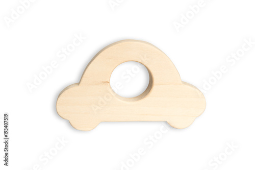 Organic baby teether isolated on white background. Wooden car toy for babies.