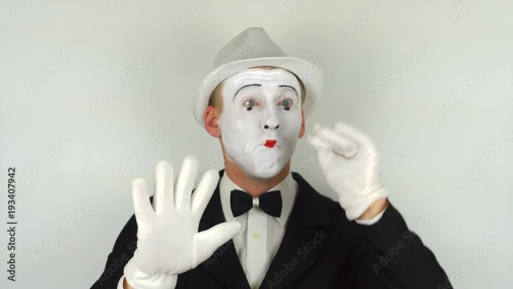 A sad mime shows tricks. 4K