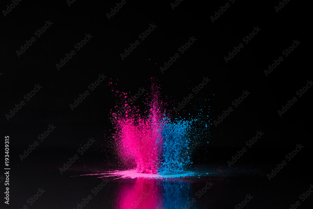 Φωτογραφία pink and blue holi powder explosion on black, traditional Indian festival of col