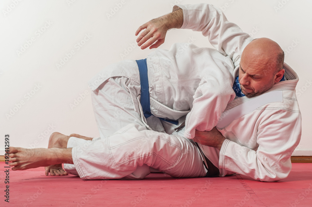 BJJ Brazilian jiu-jitsu training demonstration in traditional kimono