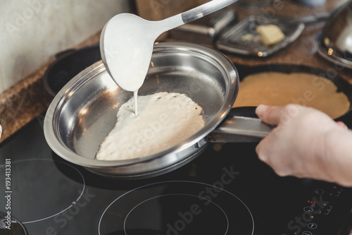 liquid dough is poured onto frying pan