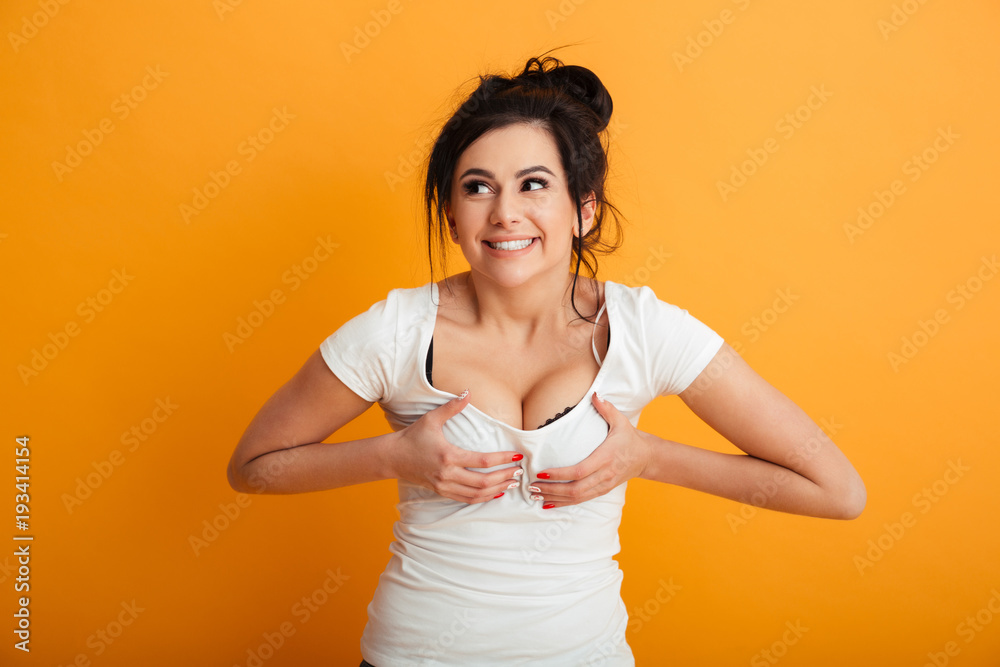 Beautiful young woman touching her breast. Stock Photo