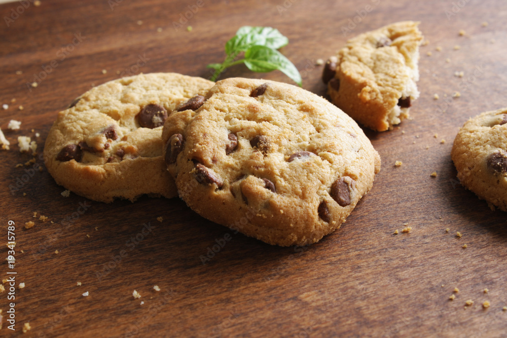 cookies with chocolate on a wooden background