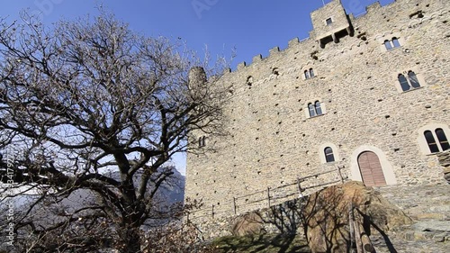 Ussel fraction of Chatillon, Valle d'Aosta, Italy 11 February 2018. Resumption of the facade of the medieval castle of Ussel. Movement of the chamber from left to right photo