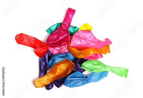 Pile of deflated colorful balloons  isolated on white background  top view