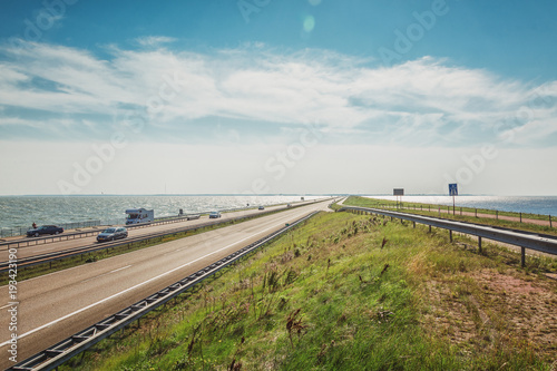 The Afsluitdijk is the thirty-two kilometer long connection between the Dutch provinces of North Holland and Friesland photo