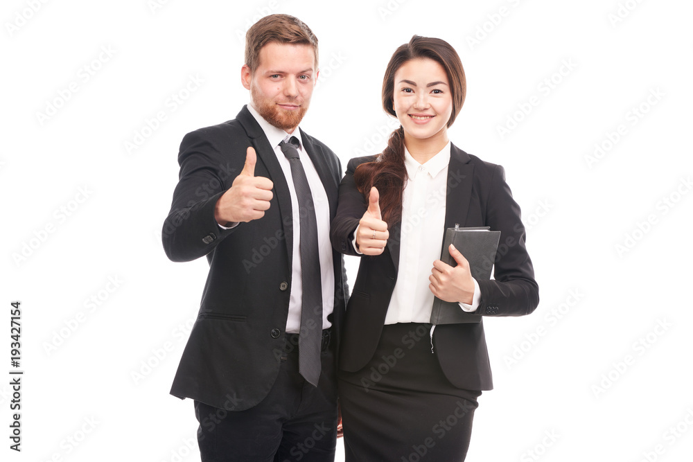 Portrait of Caucasian businessman and Asian businesswoman cooperating Portrait of Caucasian businessman and Asian businesswoman cooperating