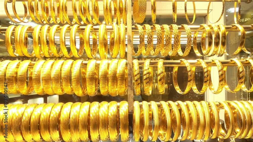 4K view of rows of gold bracelets in the shop window of the jewelry store. 4K view of rows of gold bracelets in the shop window of the jewelry store.