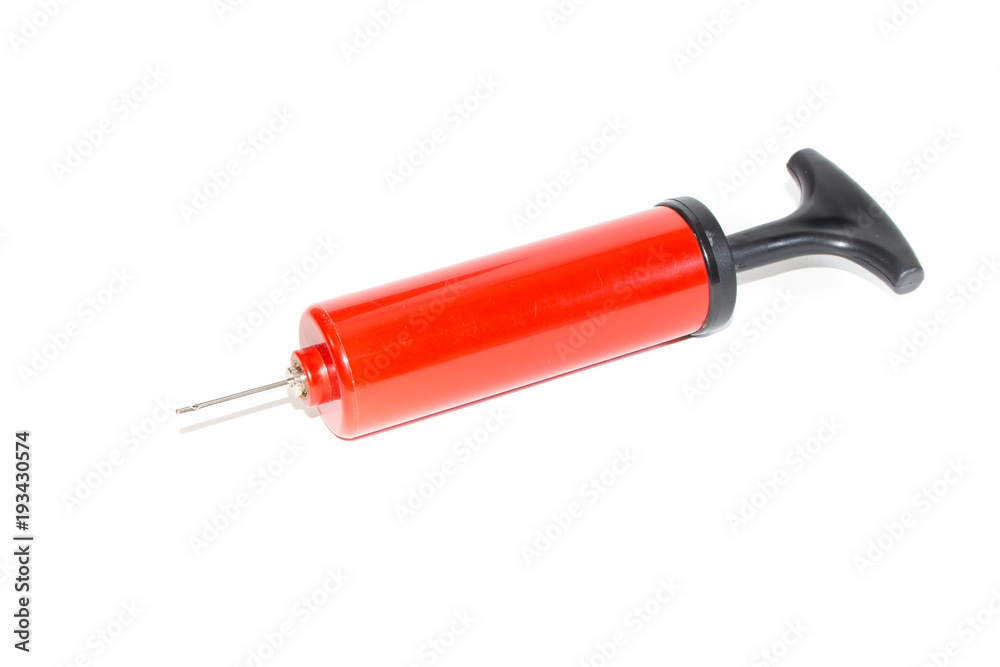 The pump to inflate balls on a white background. The pump to inflate balls on a white background.