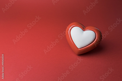 Red heart on red background