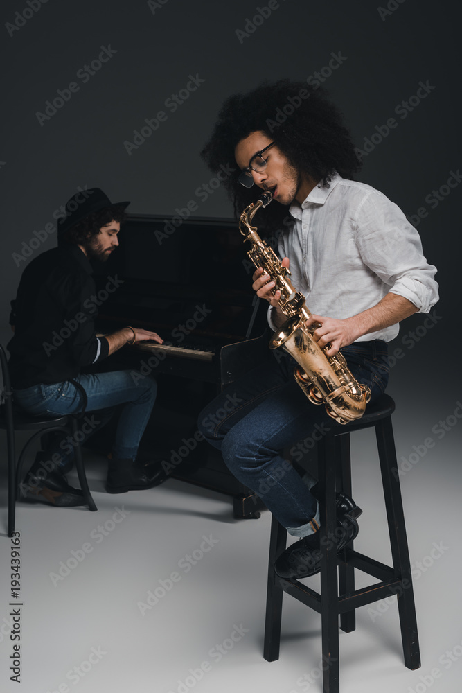 Naklejka premium duet of musicians on black