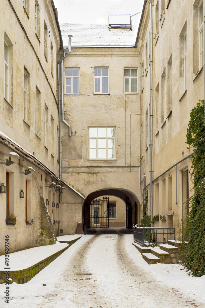 An old snowy courtyard in Vilnius, Lithuania