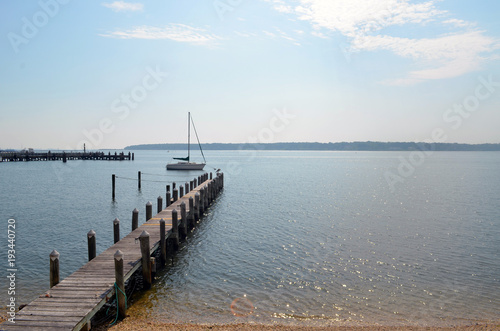 Sailboat docked in coastal harbor 