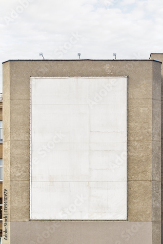 White big empty billboard on the stucco wall