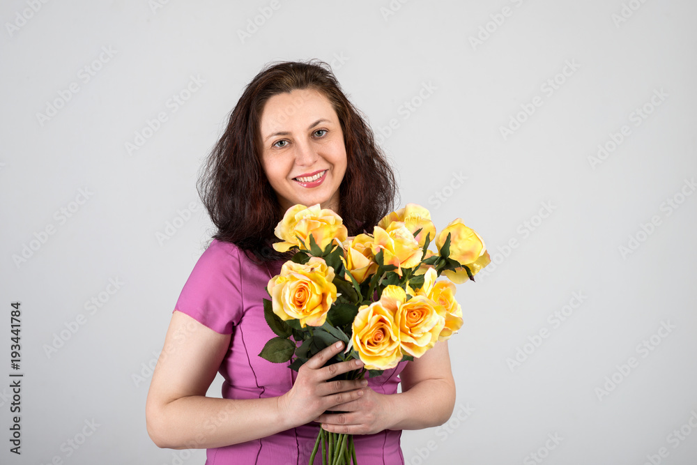 Portrait of the beautiful mature adult woman of the brunette on white backgrond.