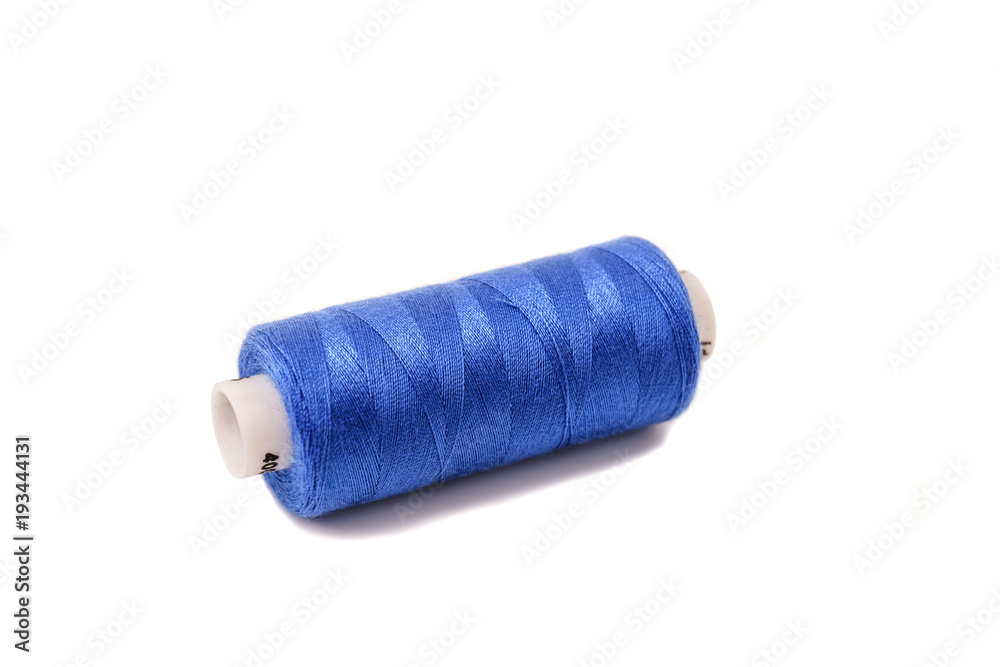 The coil with purple threads isolated on white background. Mult The coil with purple threads isolated on white background. Mult
