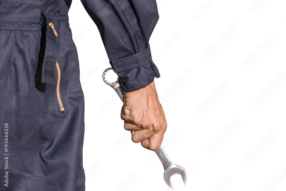 Car repairman wearing a dark blue uniform standing and holding a wrench that is an essential tool for a mechanic isolated on white background, Automotive industry and garage concepts. Car repairman wearing a dark blue uniform standing and holding a wrench that is an essential tool for a mechanic isolated on white background, Automotive industry and garage concepts.