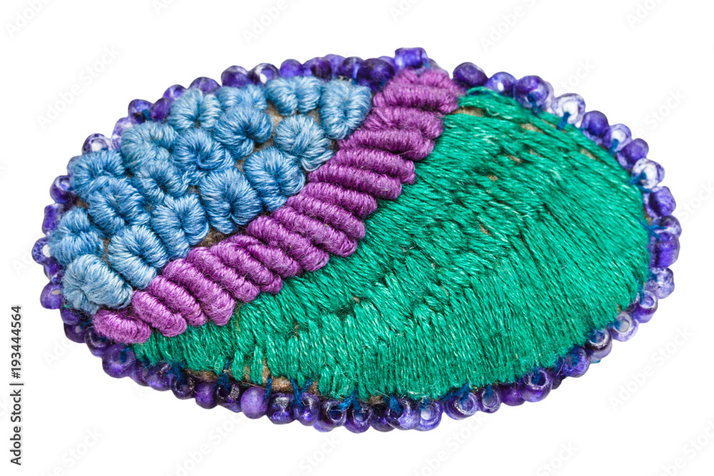 Fototapeta premium hand made knitted brooch isolated on white