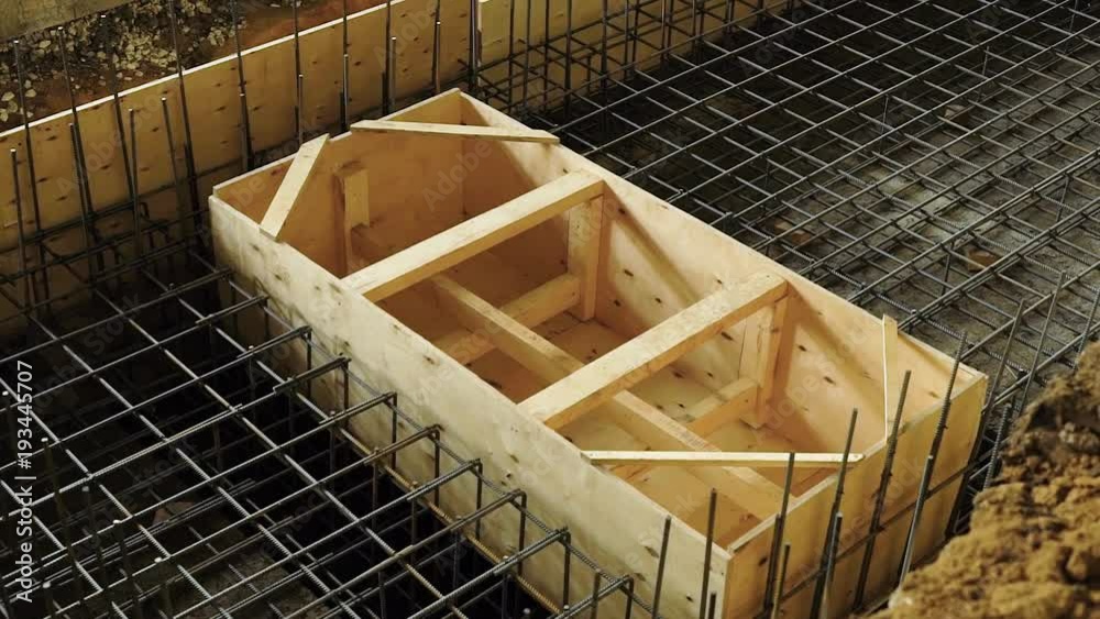 view of metal armature of carcass and wooden formwork for constructing a reinforced concrete structures