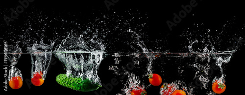 group of tomatoes in water splash