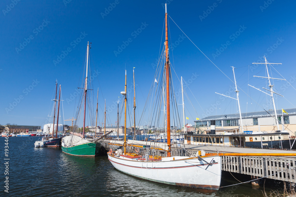 Vintage sailing yachts moored in Stockholm