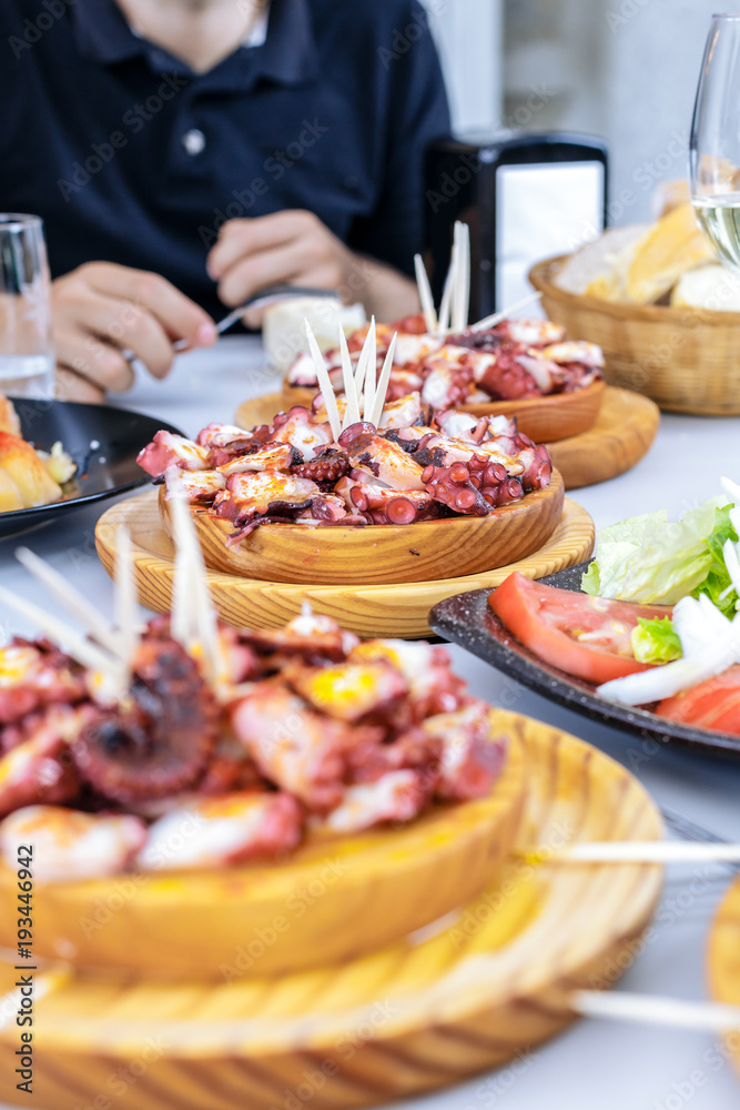 Classic Pulpo a la Gallega with potatoes. Galician octopus dishes. Famous dishes from Galicia, Spain.