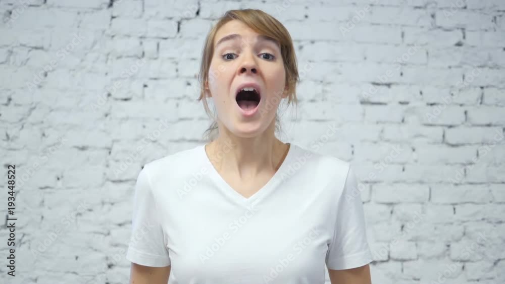 Slow Motion of Screaming Upset Young Woman in Studio Slow Motion of Screaming Upset Young Woman in Studio