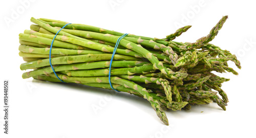 Delicious fresh green asparagus on white background photo