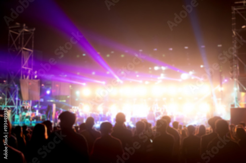 Blurred background : Bokeh lighting in outdoor concert with cheering audience © moomusician