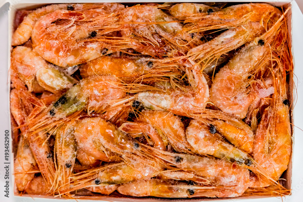 shrimp langoustine lie on a white background
