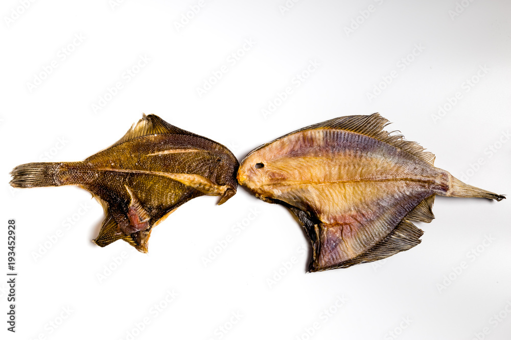 Fototapeta premium dried flounder lie on a white background