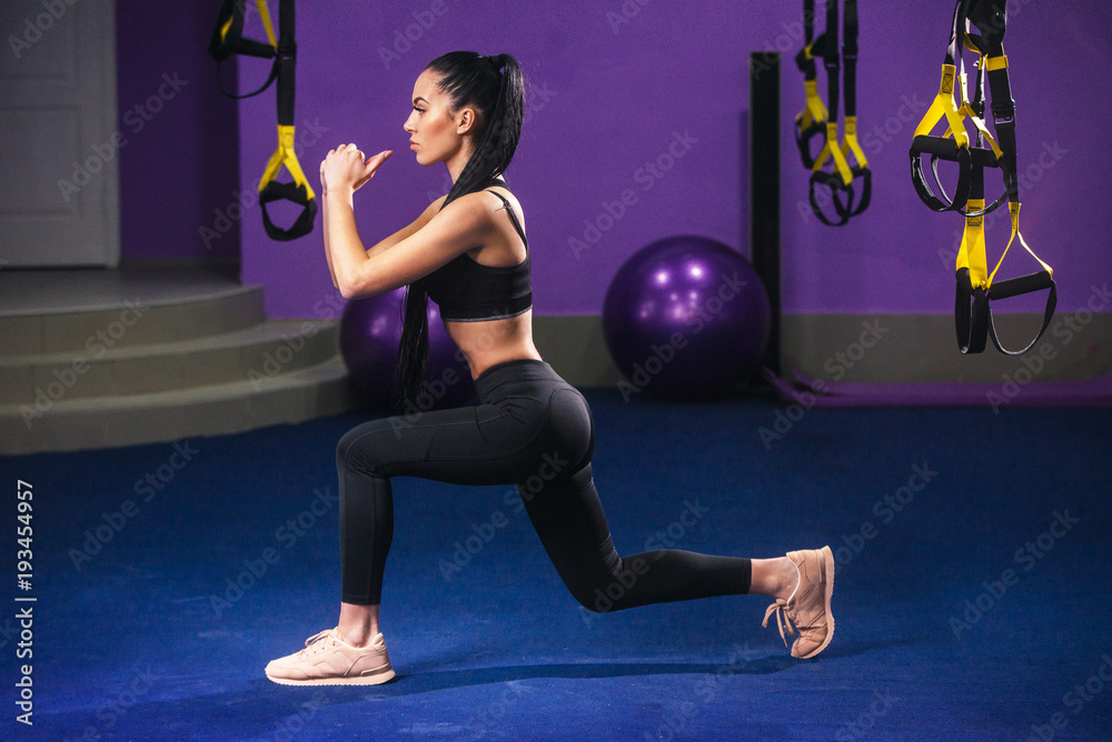 Fitness woman doing lunges exercises for leg muscle workout training ...