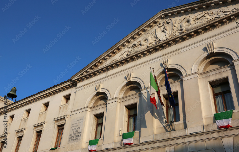 Chioggia, VE, Italy - February 11, 2018: Town hall with italian flags
